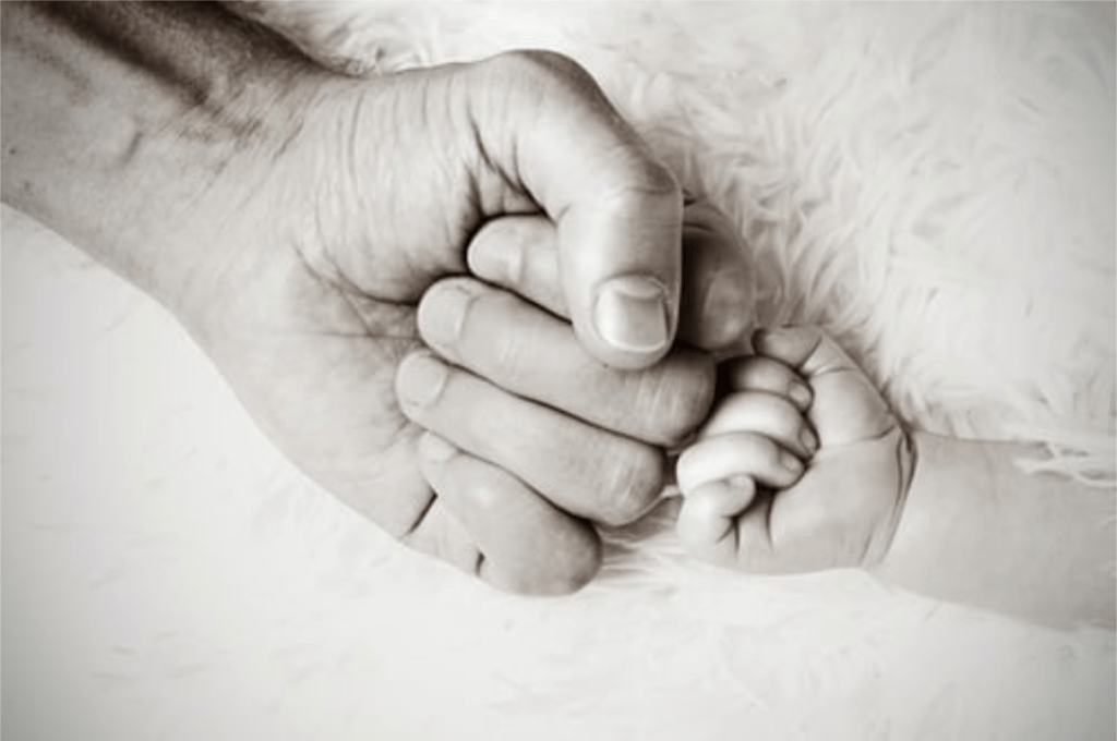 baby and father's hand to suggest family law Brisbane